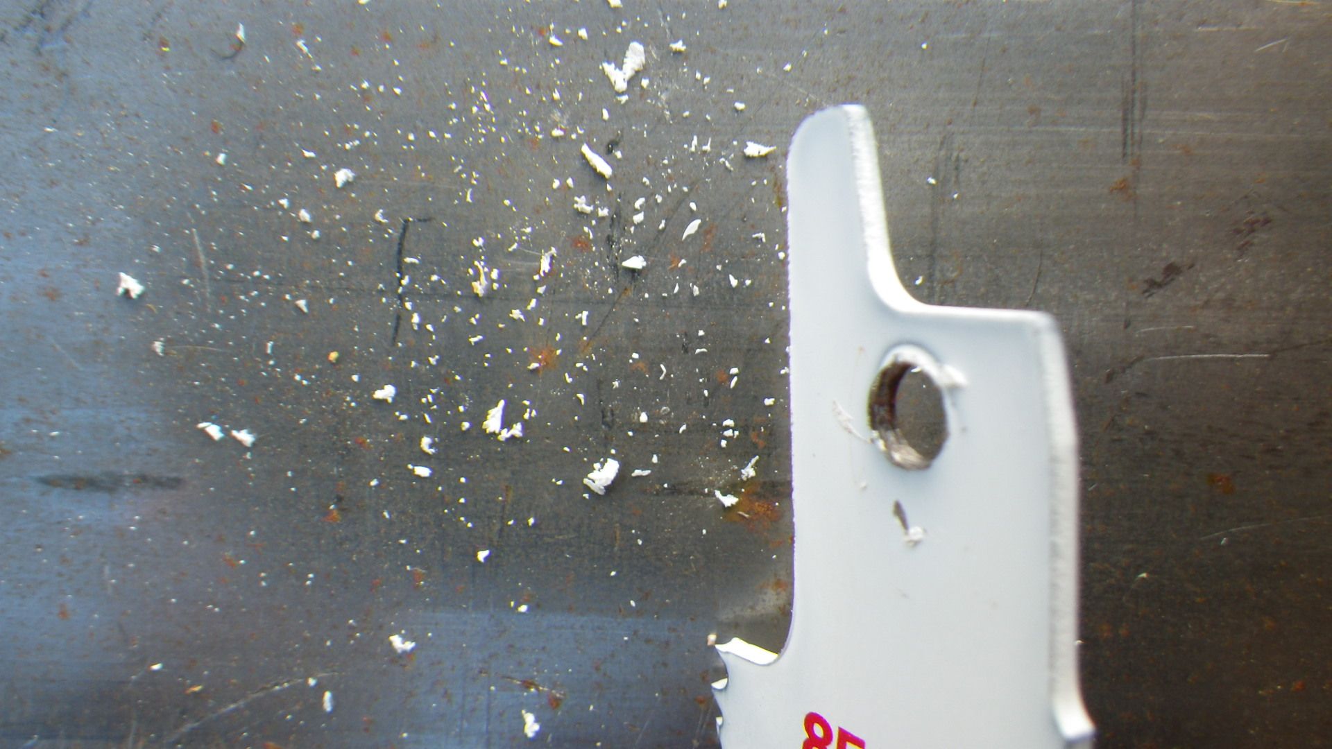 Saw blade after excess paint has been removed from the mounting hole